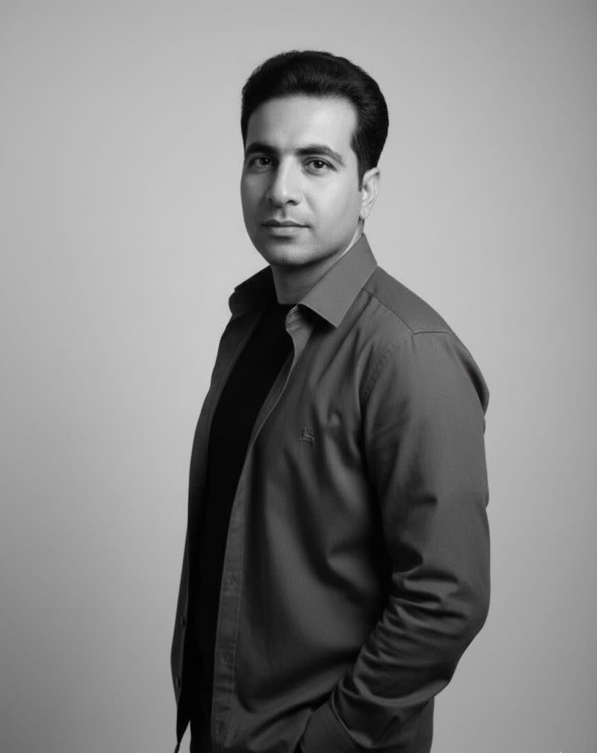 a black and white studio portrait