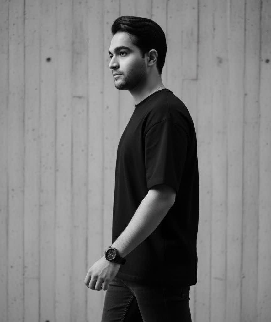 A cinematic black and white portrait of a young man