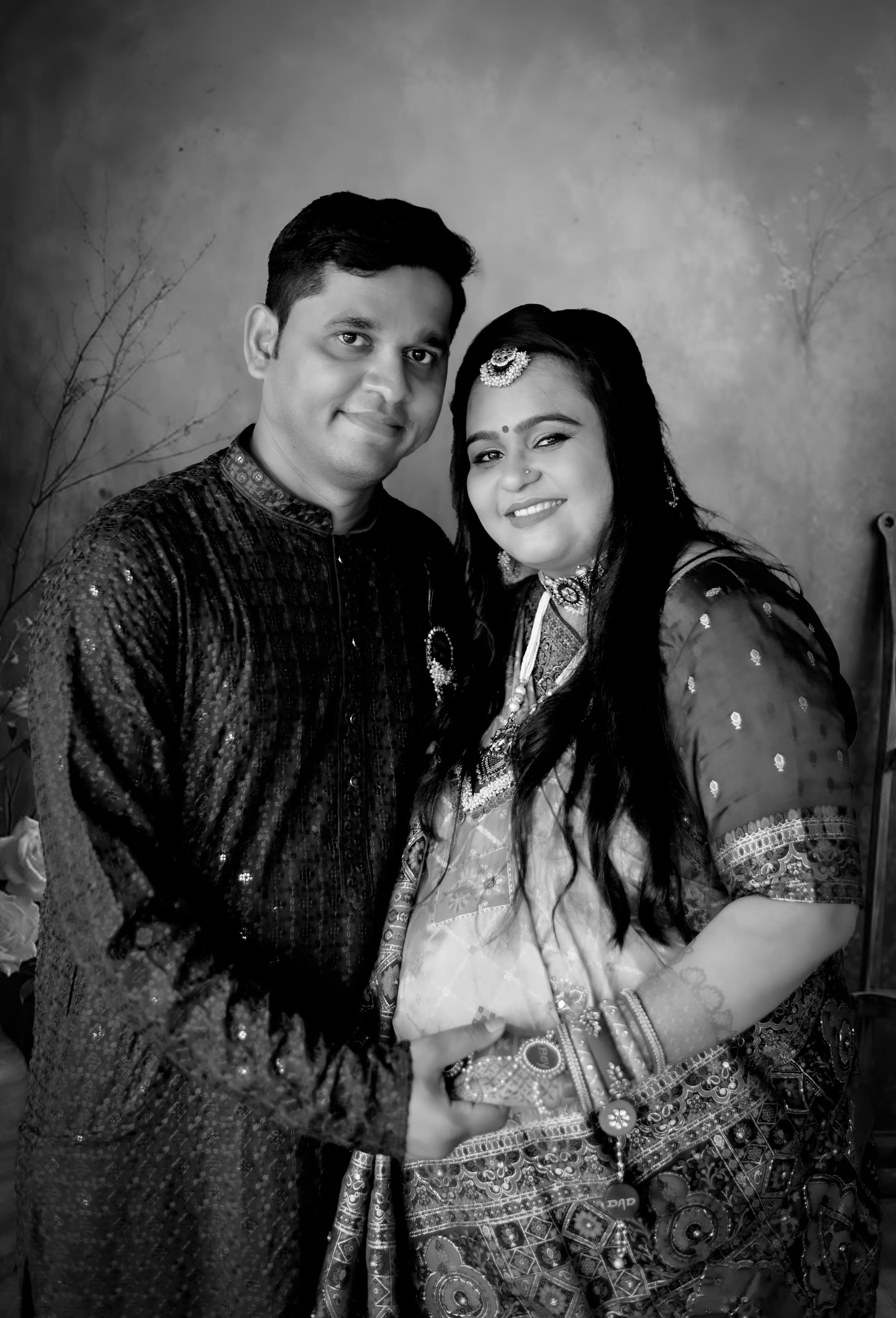 Black and white composite family portrait, three faces in profile. Baby in the foreground, mother i